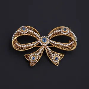 Antique Pearl and Sapphire Bow Brooch of 14k Gold