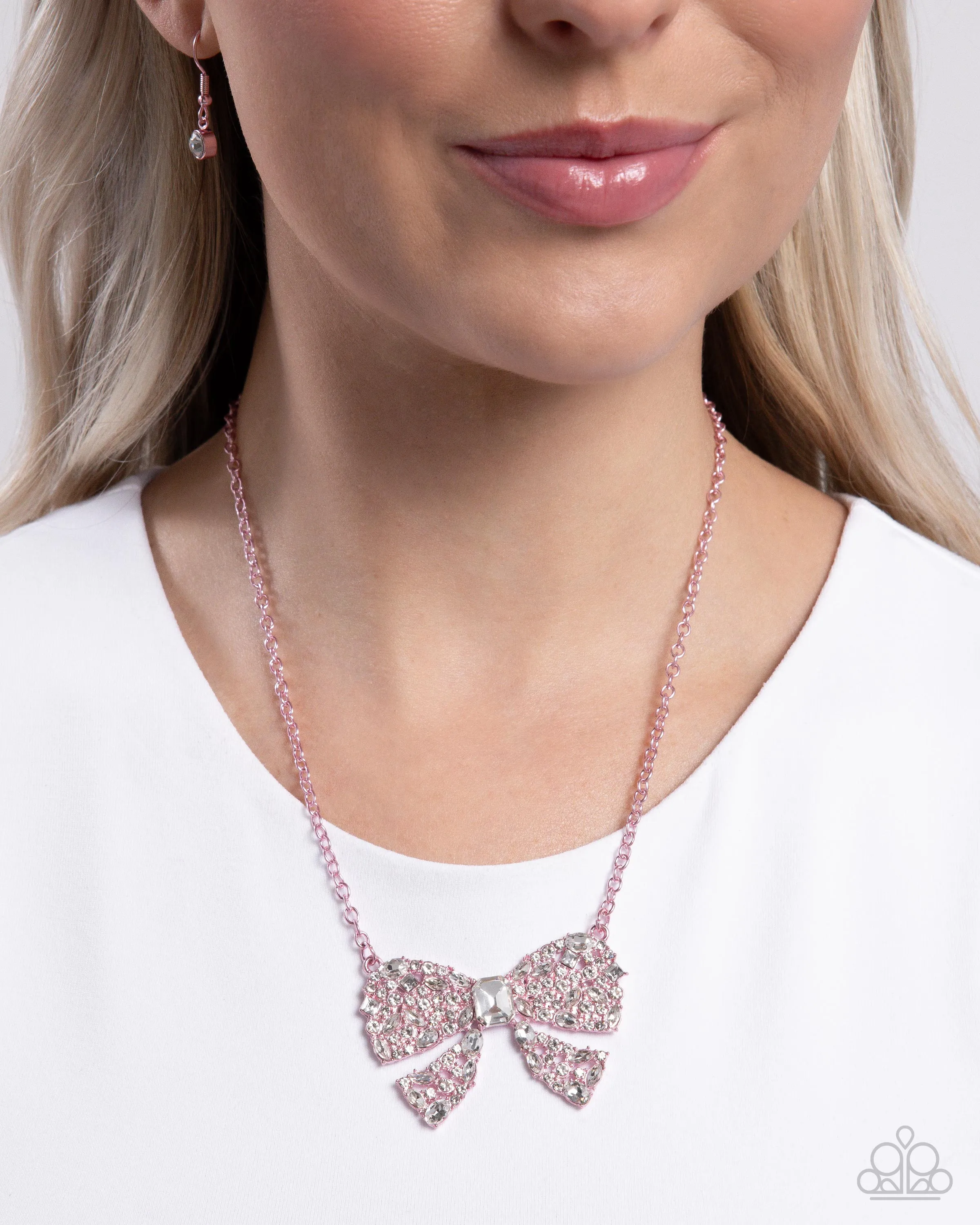 Bewitching Bow - Pink - Metallic White Rhinestone Encrusted Paparazzi Short Necklace