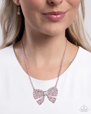 Bewitching Bow - Pink - Metallic White Rhinestone Encrusted Paparazzi Short Necklace