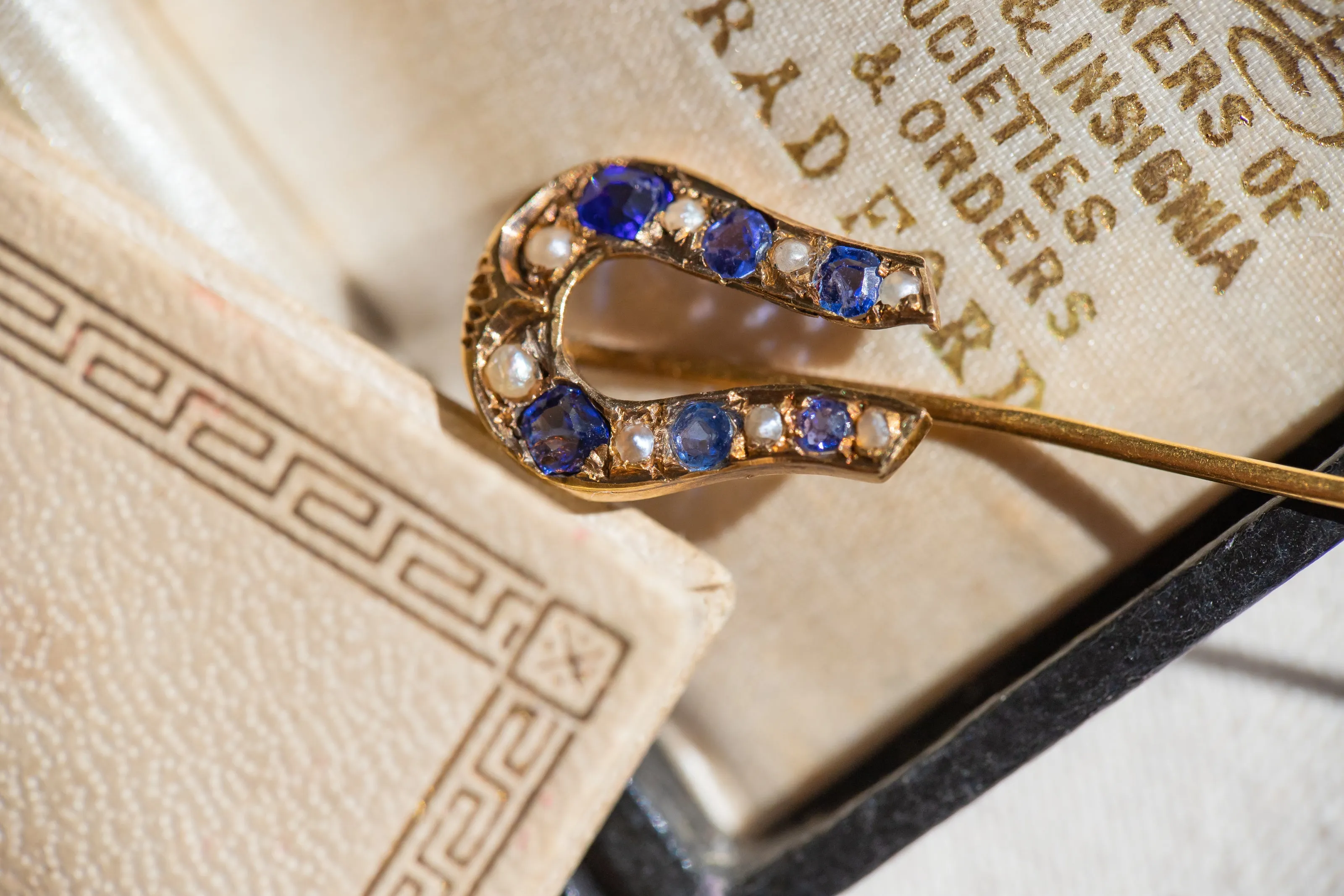 Early Victorian High Karat Gold 0.78 CTW Cornflower Spinel & Seed Pearl Horseshoe Stick Pin