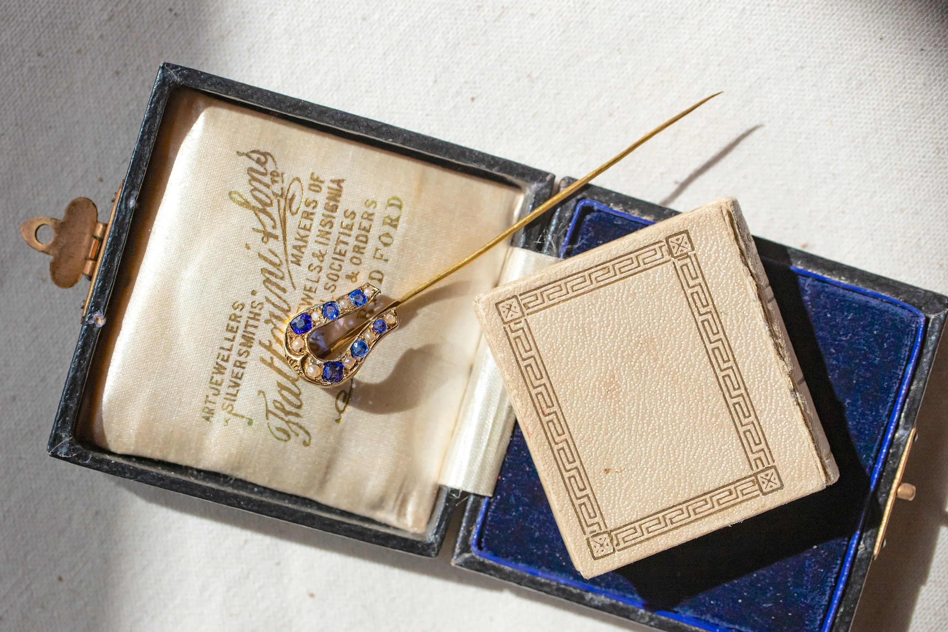 Early Victorian High Karat Gold 0.78 CTW Cornflower Spinel & Seed Pearl Horseshoe Stick Pin
