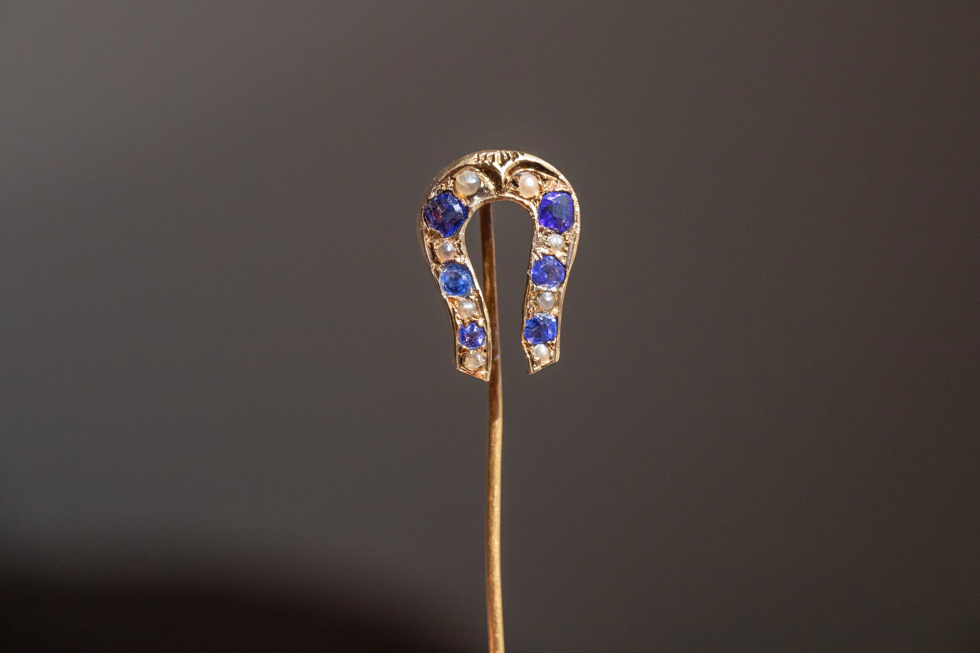 Early Victorian High Karat Gold 0.78 CTW Cornflower Spinel & Seed Pearl Horseshoe Stick Pin