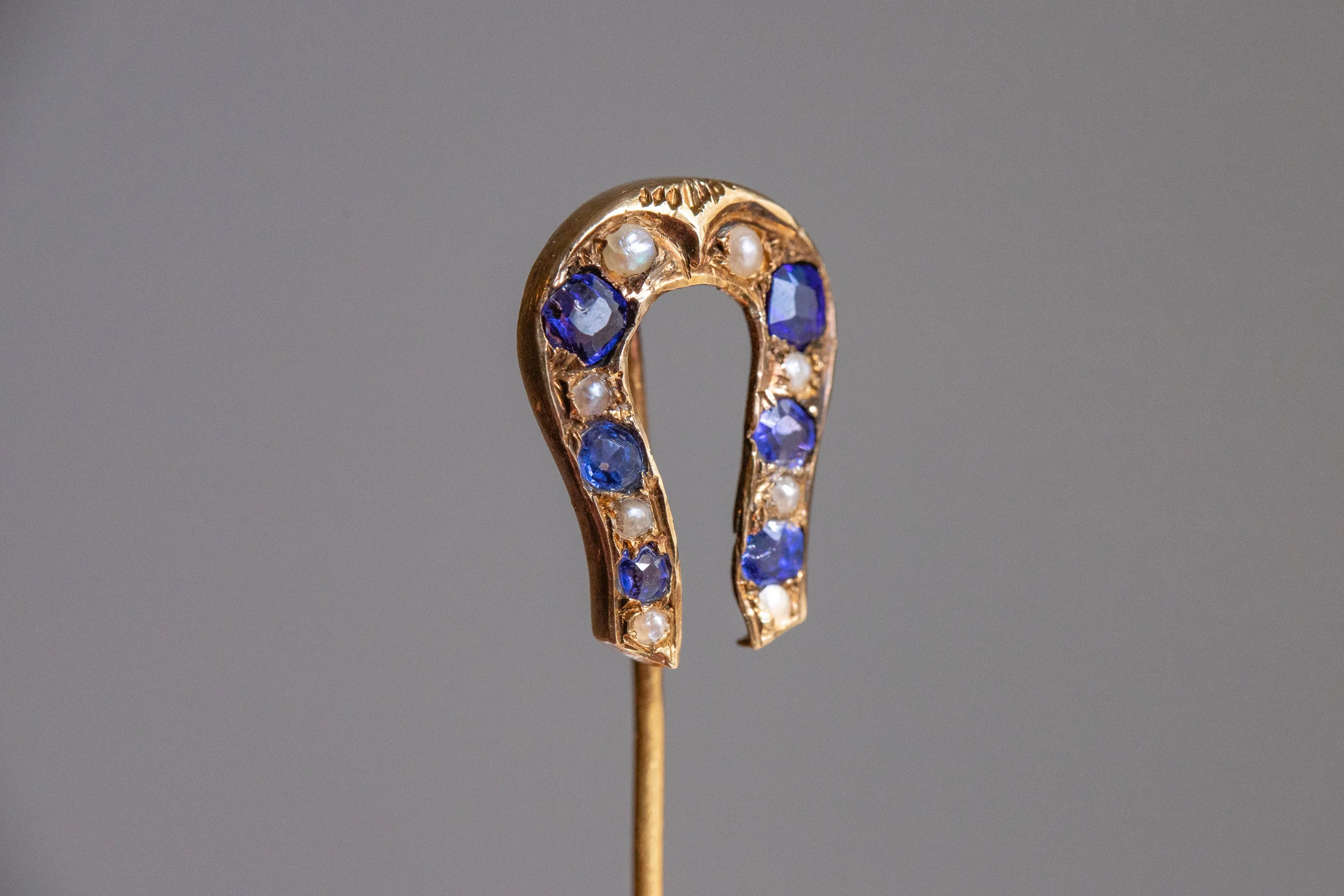 Early Victorian High Karat Gold 0.78 CTW Cornflower Spinel & Seed Pearl Horseshoe Stick Pin