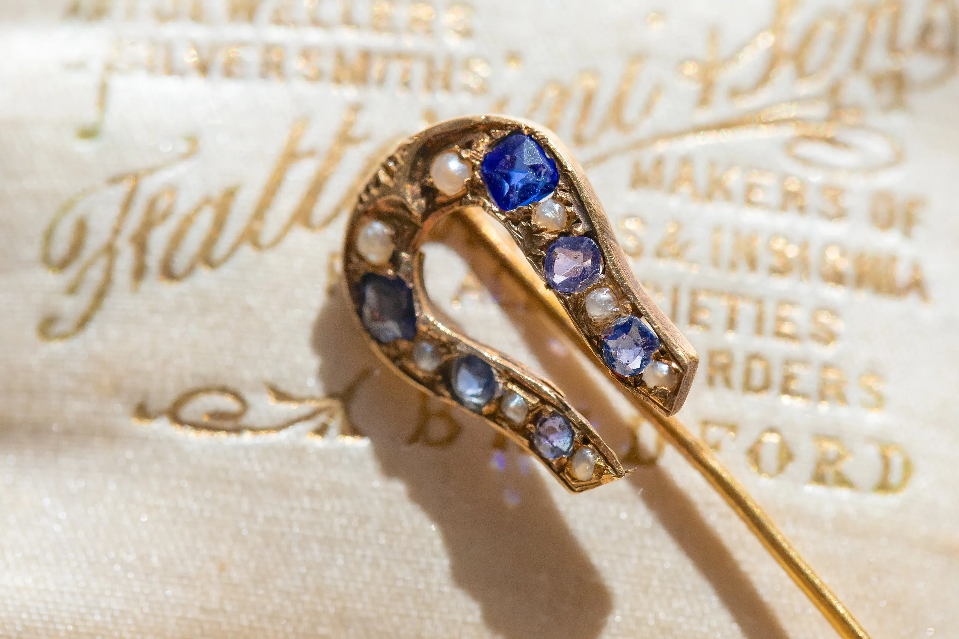 Early Victorian High Karat Gold 0.78 CTW Cornflower Spinel & Seed Pearl Horseshoe Stick Pin