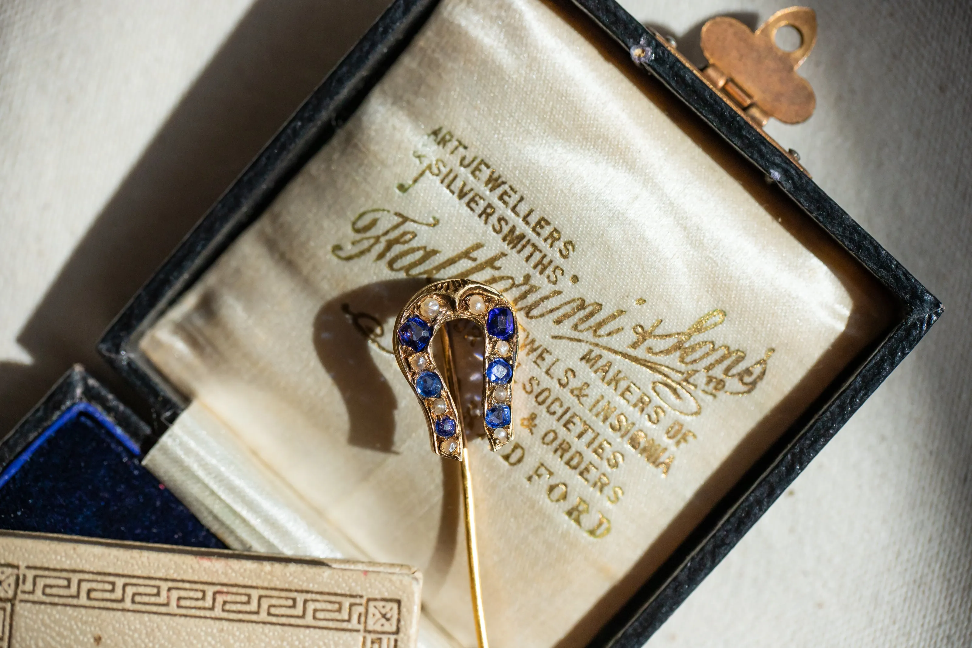 Early Victorian High Karat Gold 0.78 CTW Cornflower Spinel & Seed Pearl Horseshoe Stick Pin