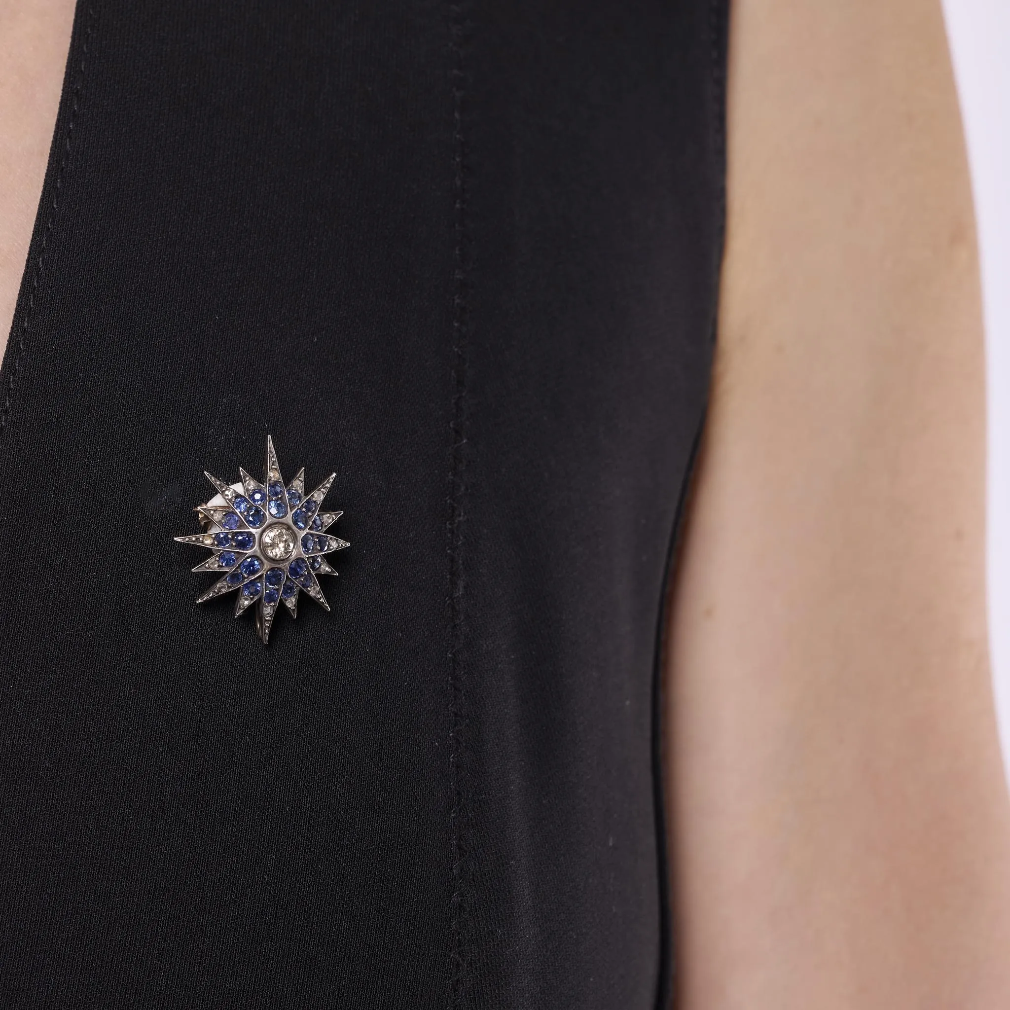 Edwardian diamond sapphire silver and 10k yellow gold star brooch