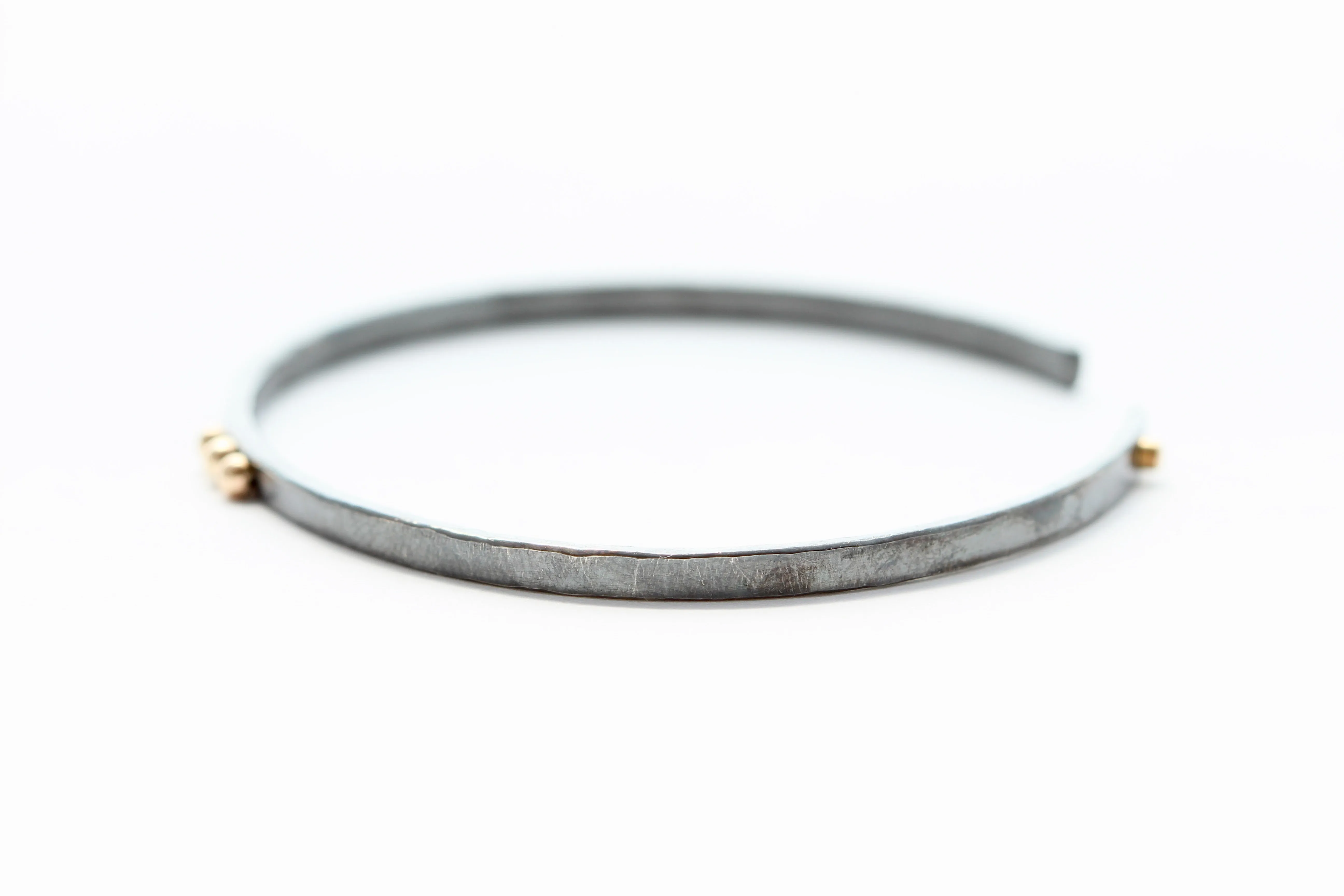 thin Oxidized sterling silver bracelet with five 14k gold