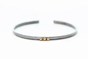 thin Oxidized sterling silver bracelet with five 14k gold